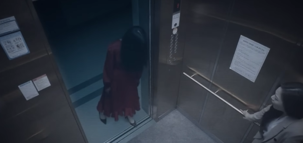 2. The Woman in Red – Người phụ nữ váy đỏ